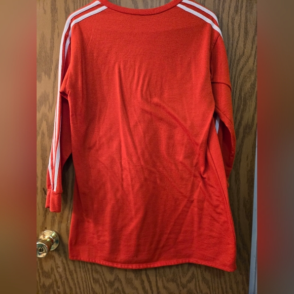 Very cute, long sleeve, orange sweat shirt with white stripes on the sleeves. - Picture 3 of 4